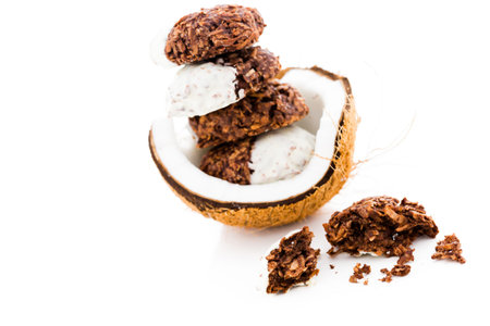 Gourmet dark dipped in white chocolate coconut macarons.の写真素材