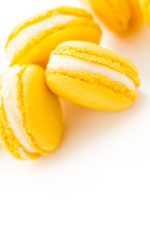Gourmet small colorful French macarons with lemon flavor.の写真素材