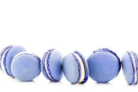 Gourmet small colorful French macarons with blueberry flavor.の写真素材