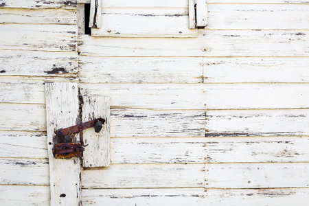 Weathered old siding painted white.の写真素材