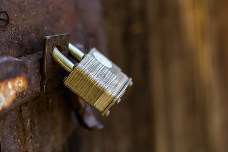 Farm door with rusted old lock.の写真素材