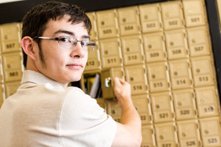 College student checking mail at mailboxed.