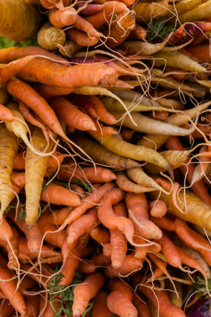 Fresh organic produce on sale at the local farmers market.の写真素材