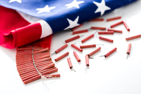 Roll of firecrackers with American flag on a white background.