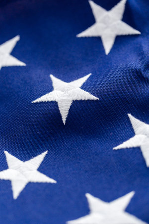 Tight closeup of the stars and stripes of an American Flag.
