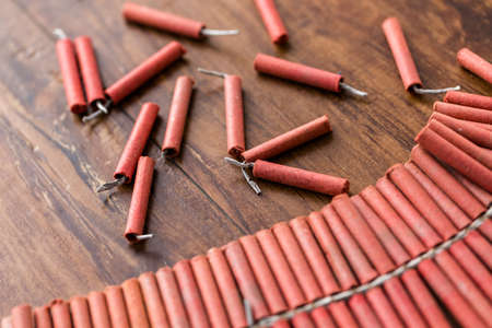 Roll of firecrackers on wood table.の写真素材
