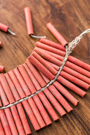 Roll of firecrackers on wood table.の写真素材
