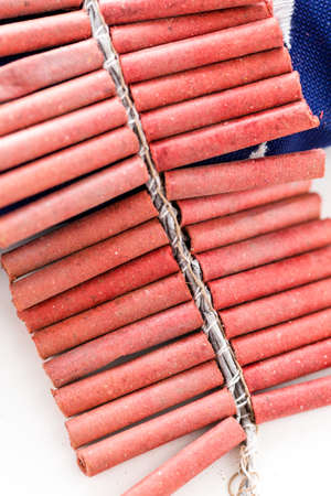 Roll of firecrackers with folded American flag.の写真素材