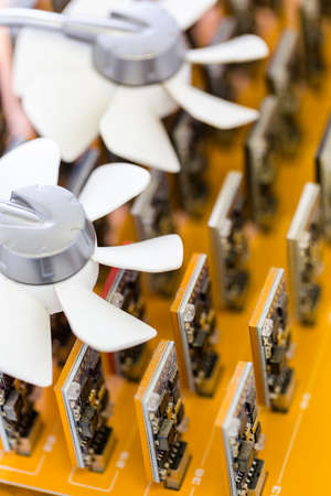 Row of USB bitcoin miners plugged into large USB board.の写真素材