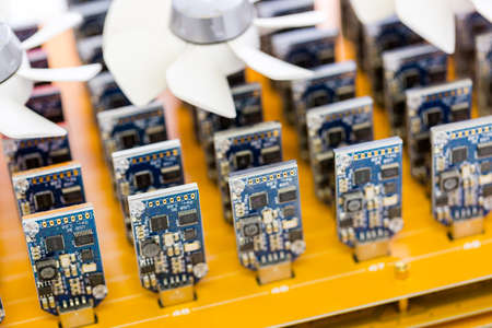 Denver, Colorado, USA-August 13, 2014. Row of USB bitcoin miners plugged into large USB board.のeditorial素材