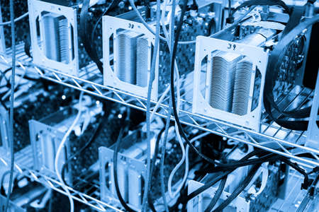 Denver, Colorado, USA-August 13, 2014. Row of bitcoin miners set up on the wired shelfs.のeditorial素材