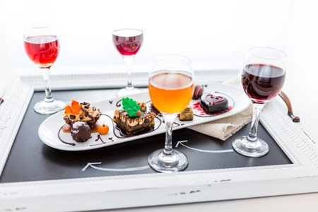 Tasting of wine and pattie chocolate pastries at the chocolate and beer and wine pairing party.の写真素材