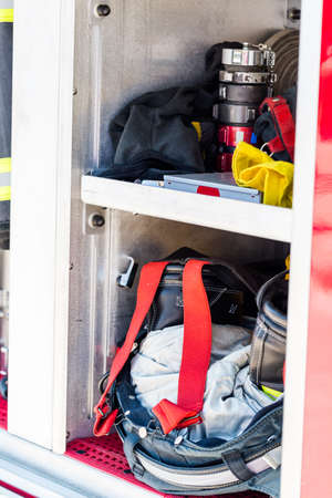 Firefighter clothing hanging on fire truck.の写真素材