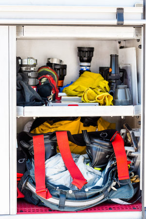 Firefighter clothing hanging on fire truck.