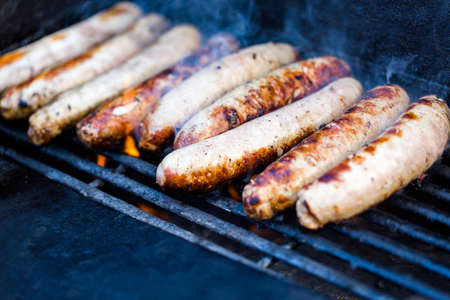 Cooking meats on barbecue grill outdoors.の写真素材