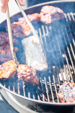 Summer outdoor cooking on barbecue grill.