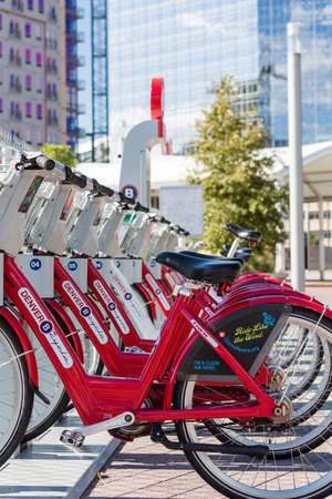 Denver, Colorado, USA-August 31, 2014. Row of red rental bikes in downtown Denver, Colorado.のeditorial素材