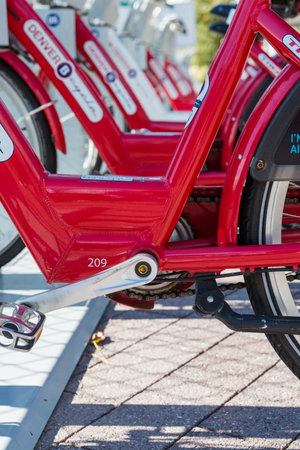 Denver, Colorado, USA-August 31, 2014. Row of red rental bikes in downtown Denver, Colorado.