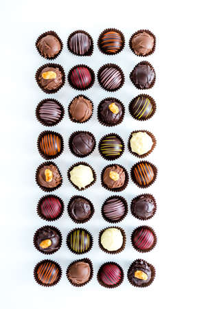 Delicious gourmet chocolate truffles hand made by professional chocolatier.の写真素材
