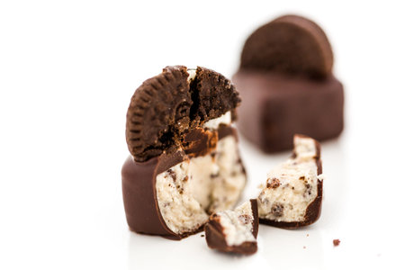 Gourmet cookies and cream truffles on a white background.