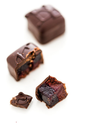 Gourmet blackberry vegan truffle on a white background.