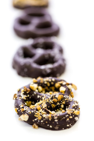 Gourmet chocolate covered pretzels on a white background.の写真素材