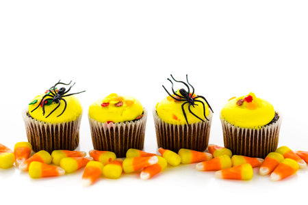Assorted cupcakes with yellow and orange icing decorated for Autumn.の写真素材