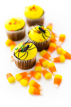 Assorted cupcakes with yellow and orange icing decorated for Autumn.の写真素材
