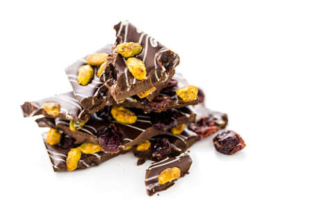 Gourmet Pistachio cherry chocolate bar on a white background.の写真素材