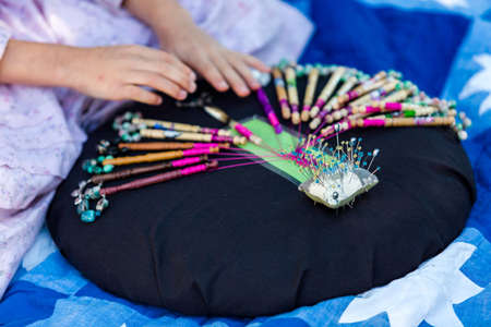 Display of vintage bobbin lace craft on historical ranch.の写真素材