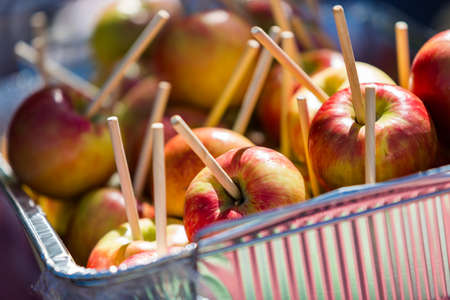 Fresh picked apples prepared for caramel dipping for party.の写真素材