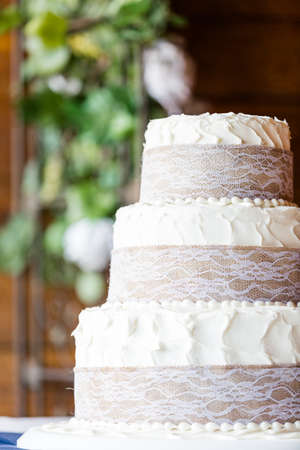 Three stack simple wedding cake in banquet hall.の写真素材