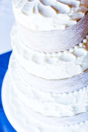 Three stack simple wedding cake in banquet hall.の写真素材