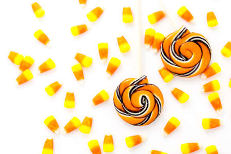 Handmade twist lollipop with orange and black stripes.の写真素材