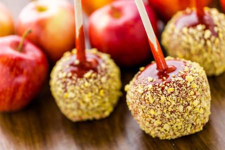 Hand dipped caramel apples decorated for Halloween.の写真素材