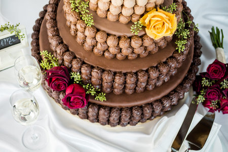 Gourmet tiered wedding cake as centerpiece at the wedding reception.