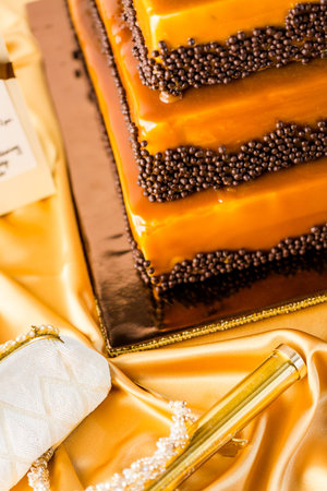 Gourmet tiered wedding cake as centerpiece at the wedding reception.の写真素材