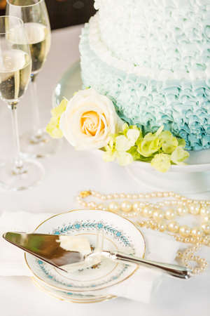 Gourmet tiered wedding cake as centerpiece at the wedding reception.の写真素材