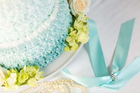 Gourmet tiered wedding cake as centerpiece at the wedding reception.の写真素材