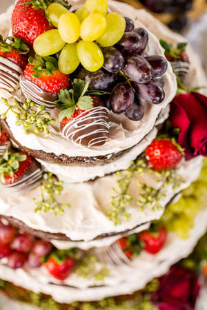 Gourmet tiered wedding cake at wedding reception.の写真素材