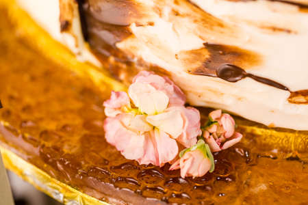 Gourmet tiered wedding cake at wedding reception.の写真素材