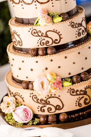 Gourmet tiered wedding cake at wedding reception.の写真素材