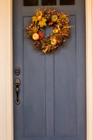 Autumn wreath decorating front door.の写真素材