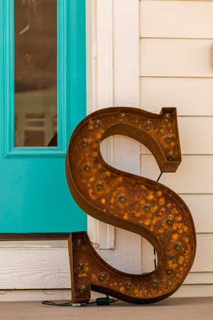 Large letter S made from rusted metal on the front poarch.の写真素材