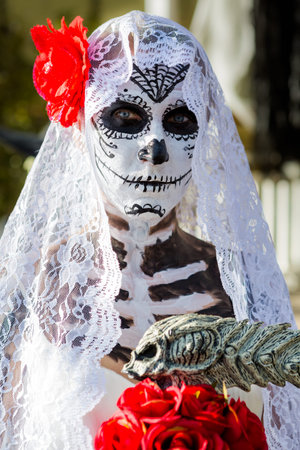Trick or treating in costumes on Halloween night.