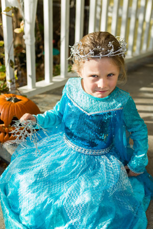 Trick or treating in costumes on Halloween night.の写真素材