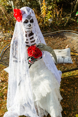 Trick or treating in costumes on Halloween night.