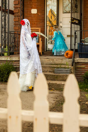 Trick or treating in costumes on Halloween night.の写真素材