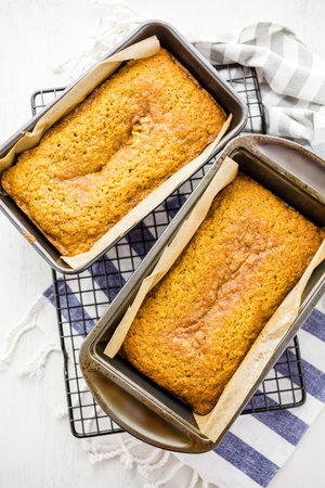Homemade pumpkin bread right out of the oven on drying rack.の写真素材
