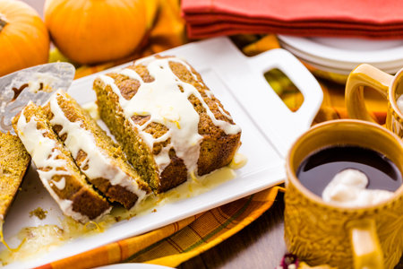 Homemade pumpkin bread with orange glazing on top.の写真素材